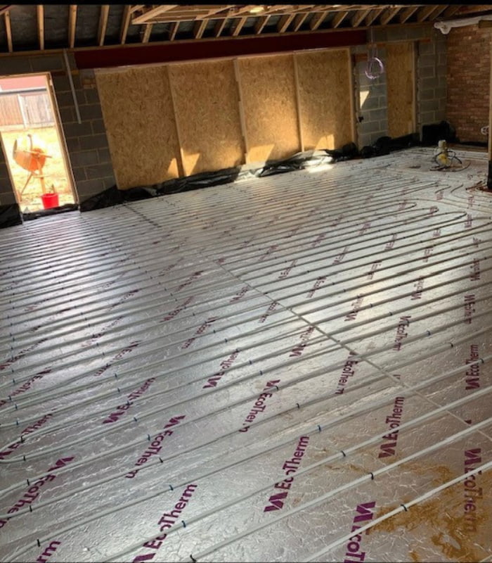 Underfloor heating installation in progress
